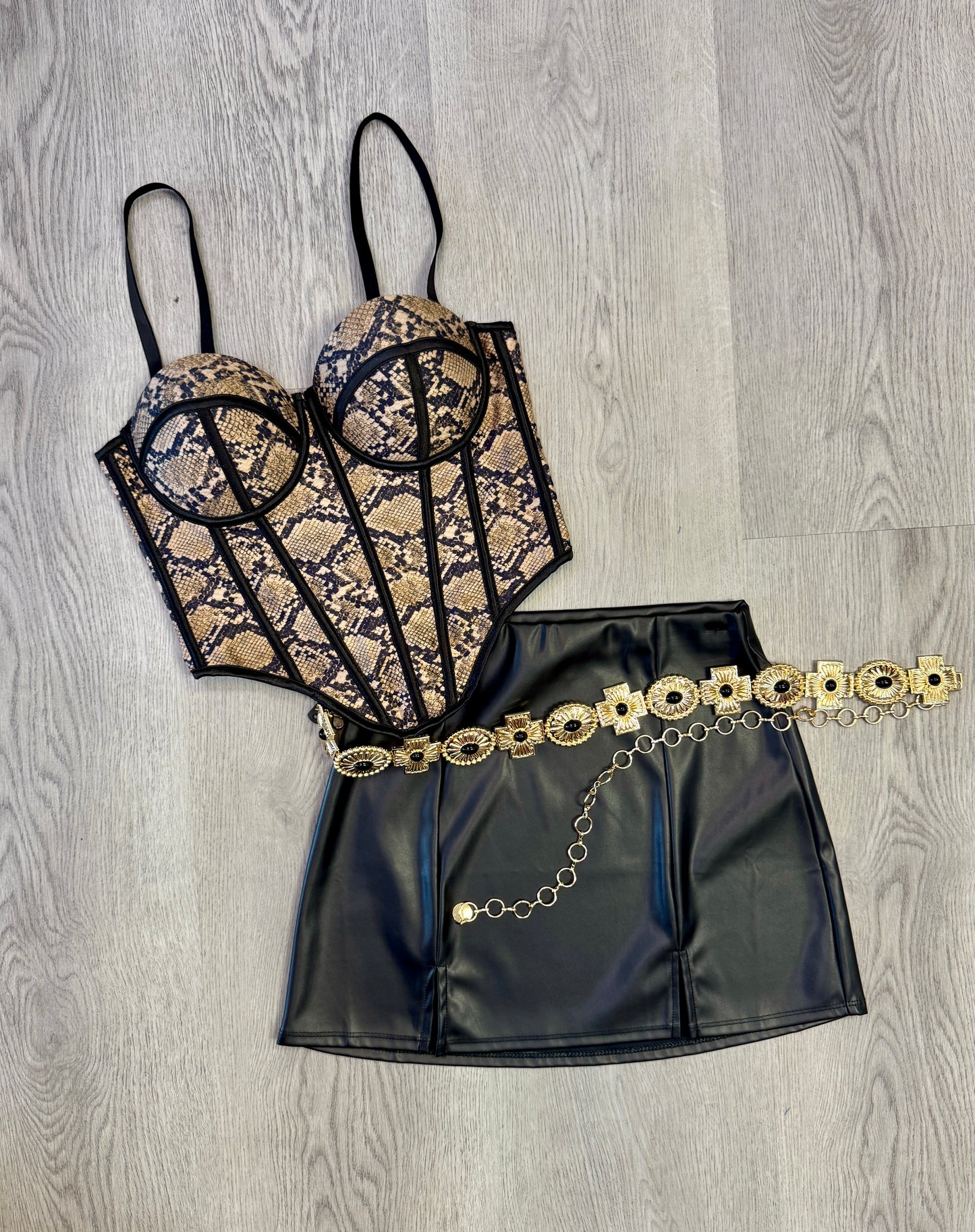 Women wearing snakeskin corset top from Lily's Fashion Boutique