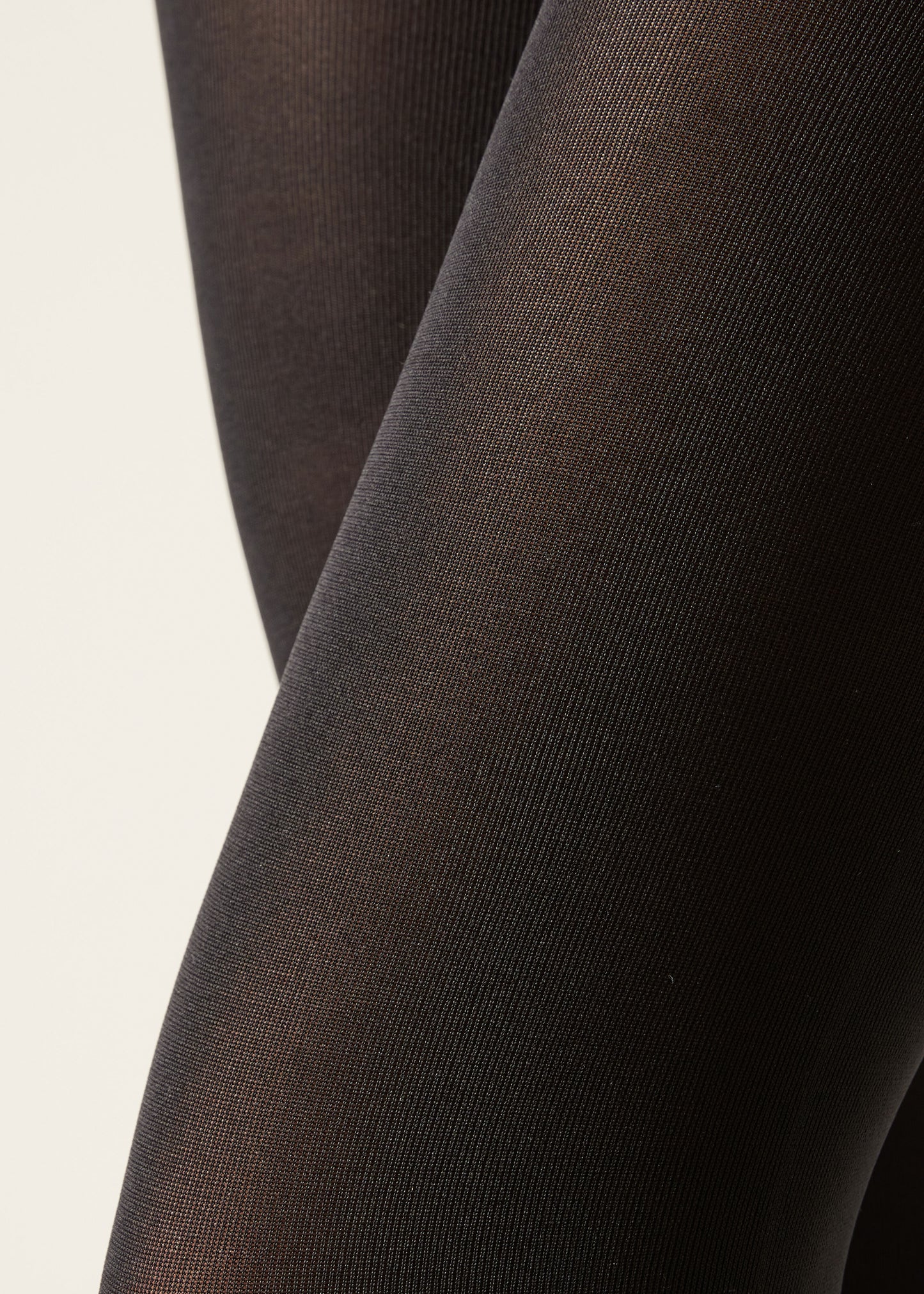 Close-up of black tights on a light background