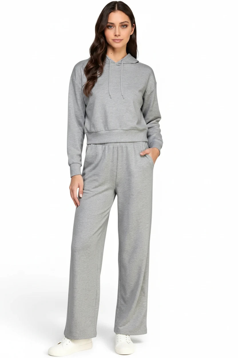 Women modeling a gray relaxed-fit hoodie and straight leg pants lounge set.