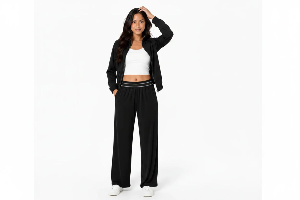 Women wearing the Avery black zip-up jacket and wide-leg pants two-piece activewear set.