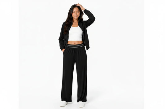 Women wearing the Avery black zip-up jacket and wide-leg pants two-piece activewear set.