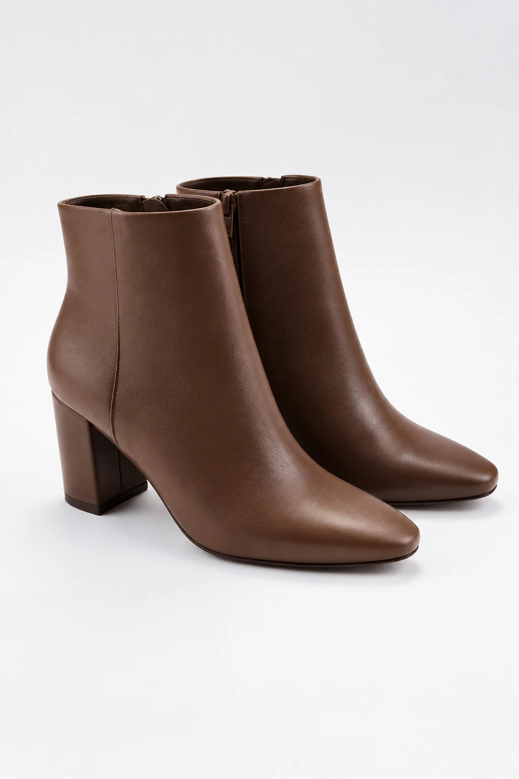 Vanessa brown block heel ankle booties with a sleek pointed-square toe and side zipper.