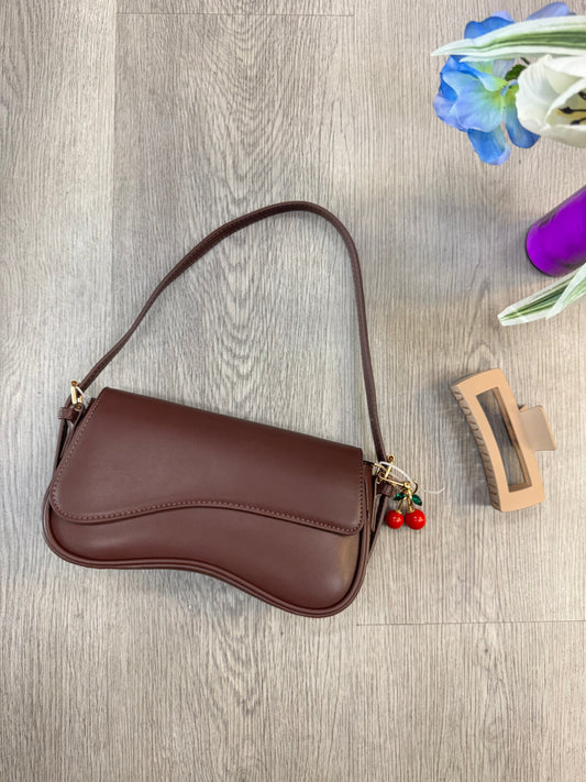 Brown Amara Curve Shoulder Bag with adjustable strap from women's boutique.