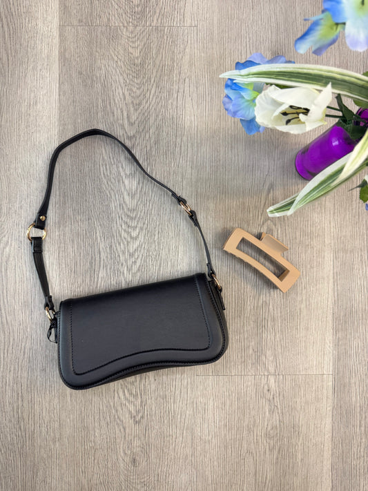 Black noir curve shoulder bag with gold hardware from women's boutique. Lily's Fashion Boutique