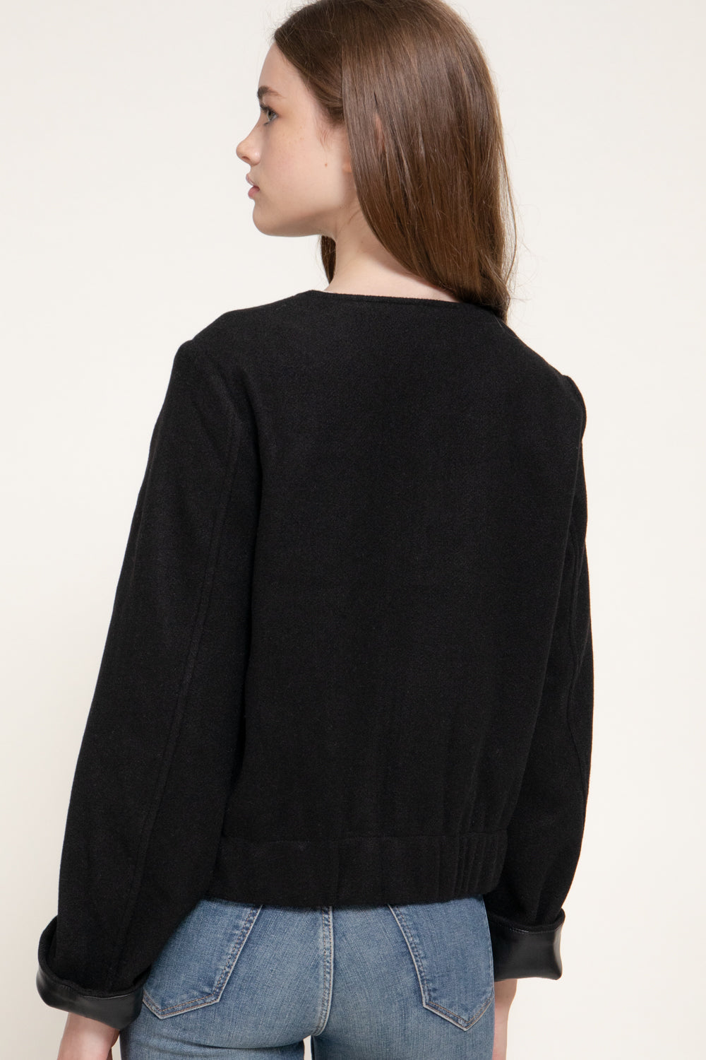 back view of the black felt-style jacket.