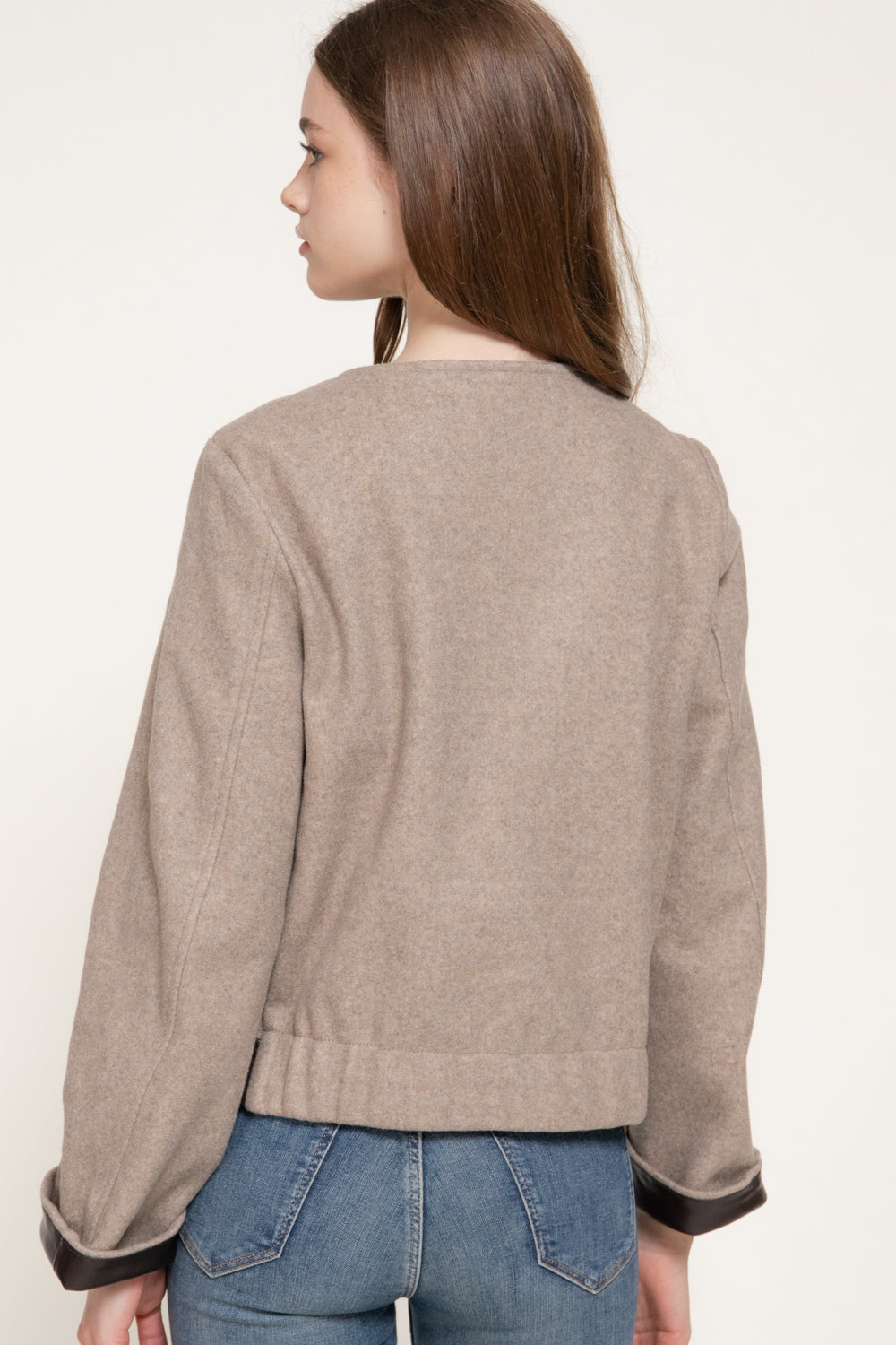 back view of the beige jacket.