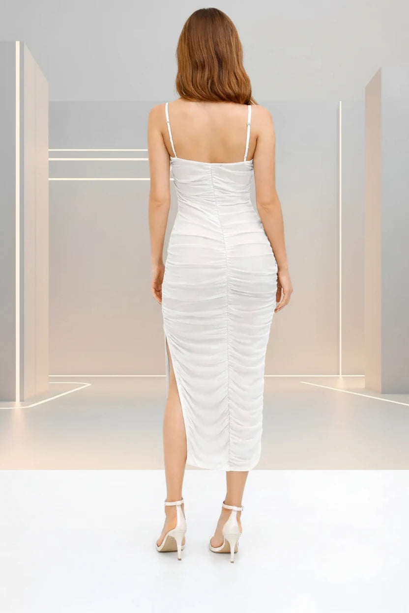 Woman wearing a white ruched dress on a white background