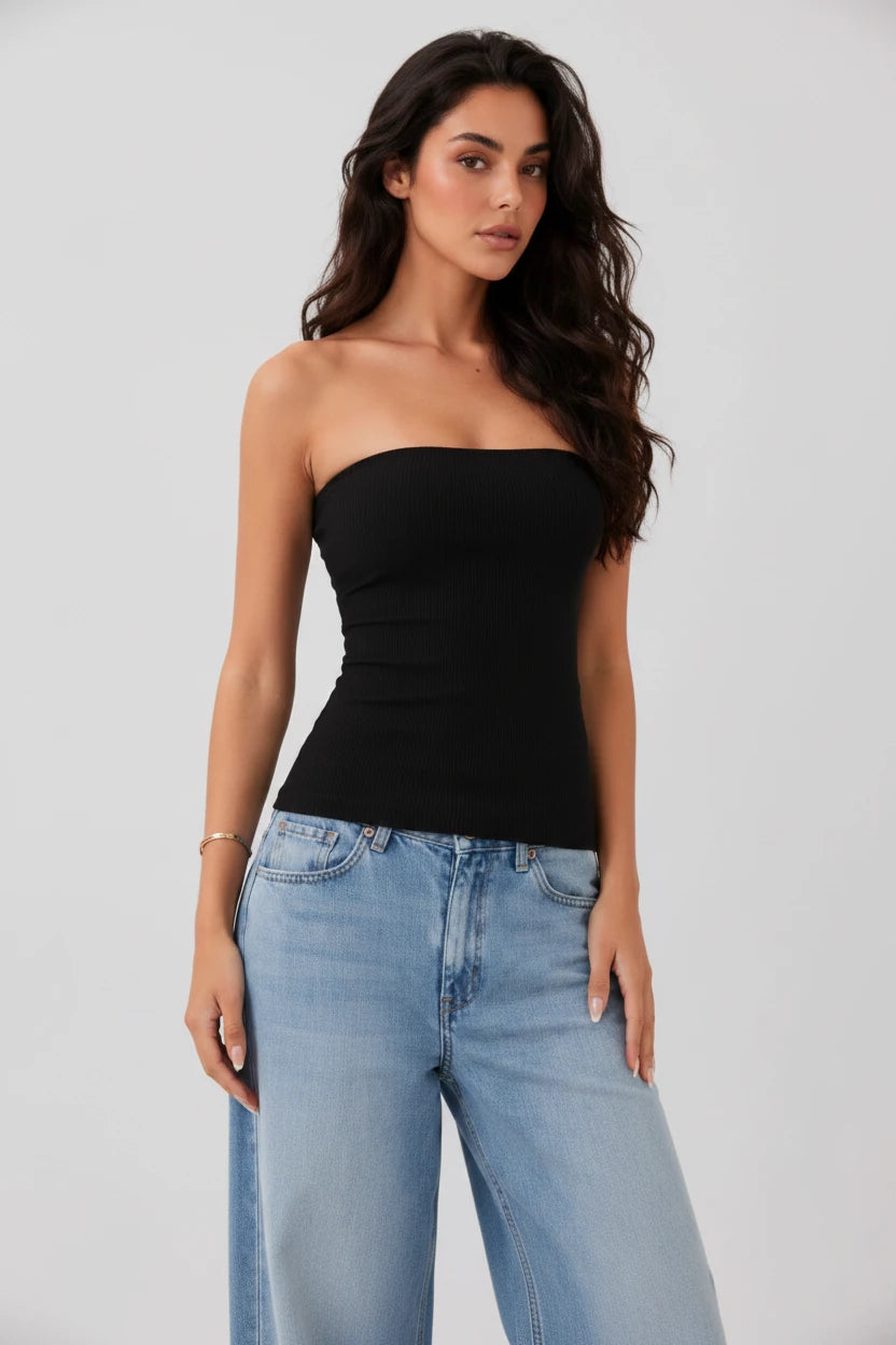 Women's black strapless tube top with built in bra, styled with light wash relaxed-fit jeans. A flattering fitted top perfect fro summer outfits, casual wear, vacations, concerts, and layering. Comfortable, stretchy, and true to size.